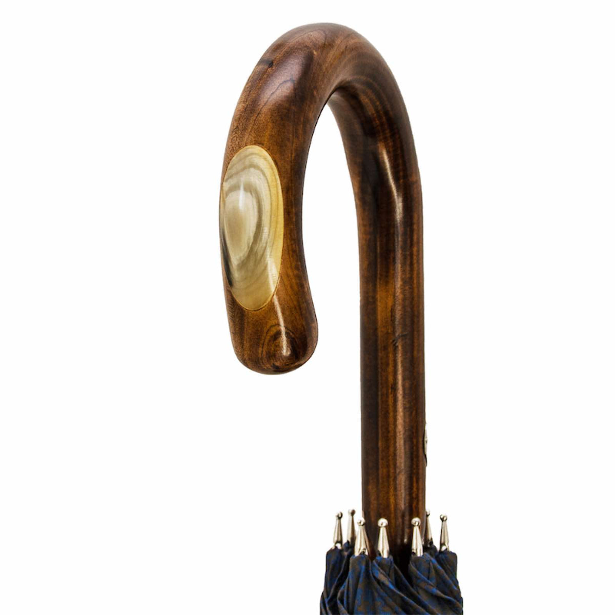 Maple crook handle with a polished horn inlay, close-up