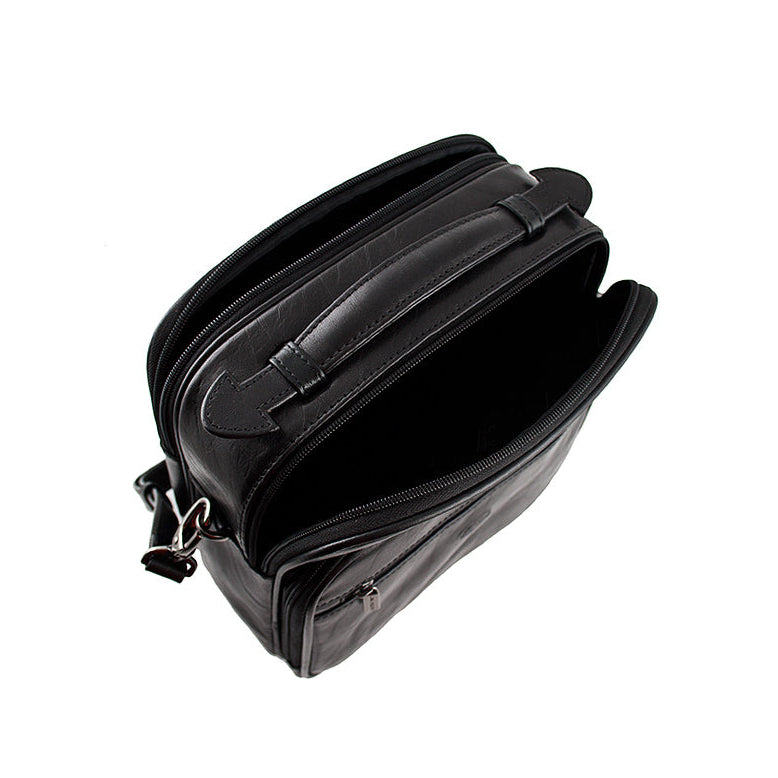 Top view of the black Tony Perotti Italico 7058 with the first main compartment open — top handle and D-ring for the strap