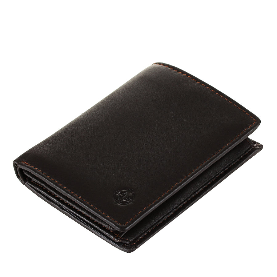 Dark brown Tony Perotti Cortina 5088 moro card wallet lying tilted — the closed fold and the embossed compass rose