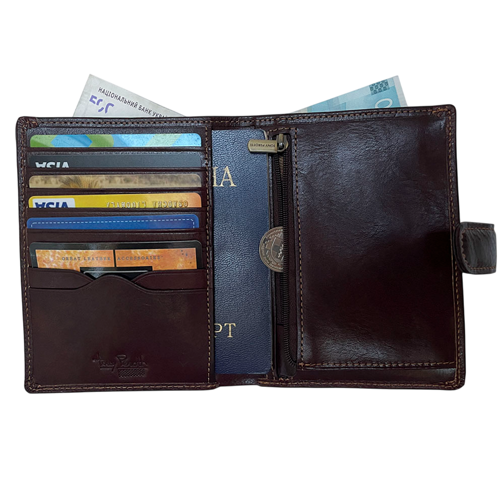 Tony Perotti Italico 3274A moro passport wallet opened with cards, a passport in the transparent sleeve, banknotes and a coin in the zip pocket