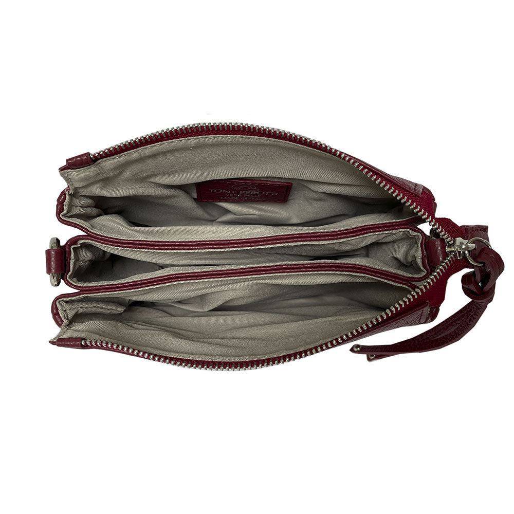 Tony Perotti Borsa CA04B-30DR red leather bag open from above — the three compartments inside, lined in greyish beige textile, with the Tony Perotti label