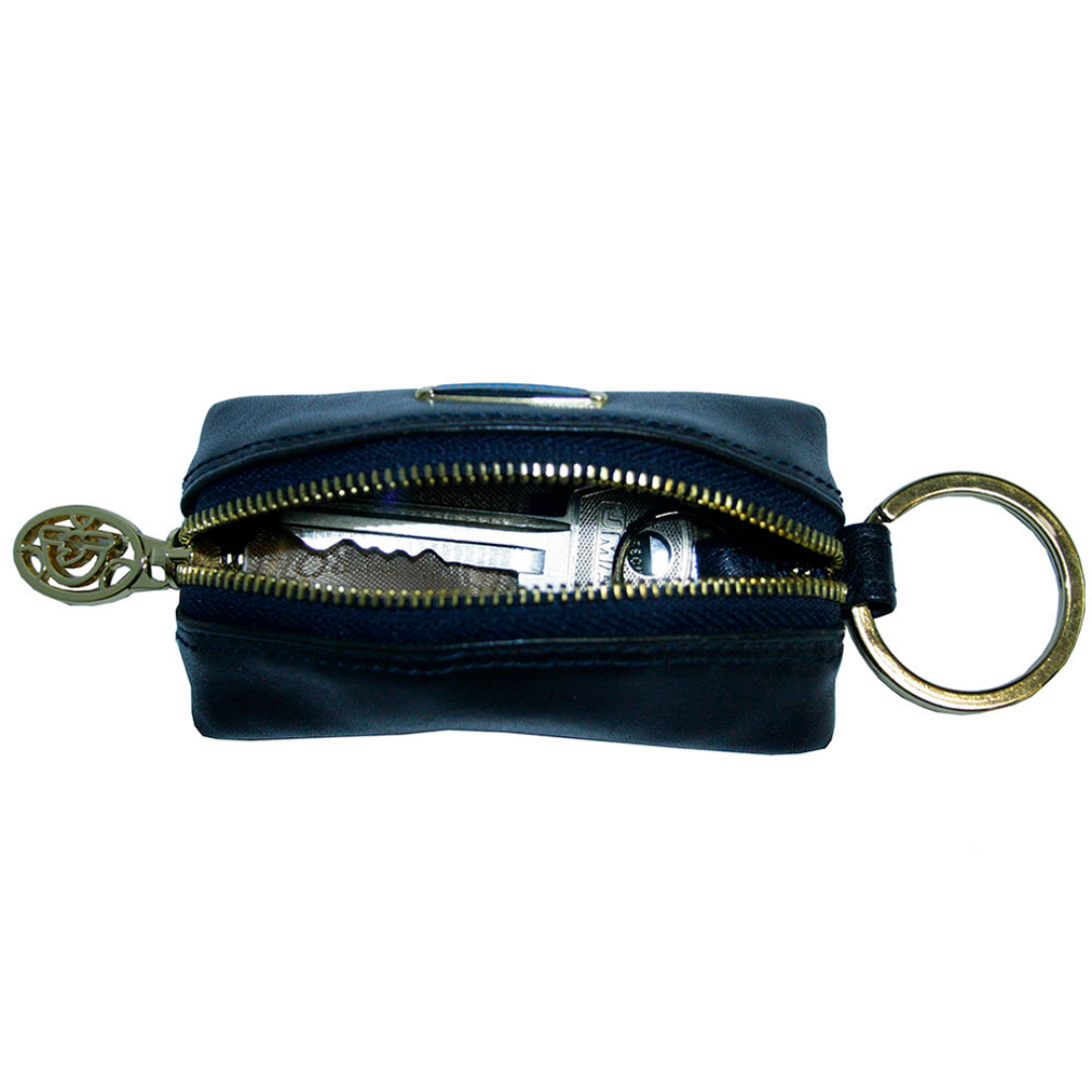 Tony Perotti Topkapi KR-186 navy — the case unzipped with a car key and fob inside, showing the light grey lining and the split ring on its leather tab