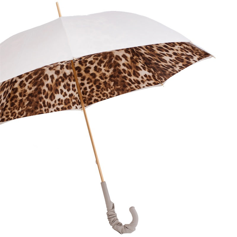 Open umbrella from the side: ivory outer canopy, leopard print inside and gold-tone shaft