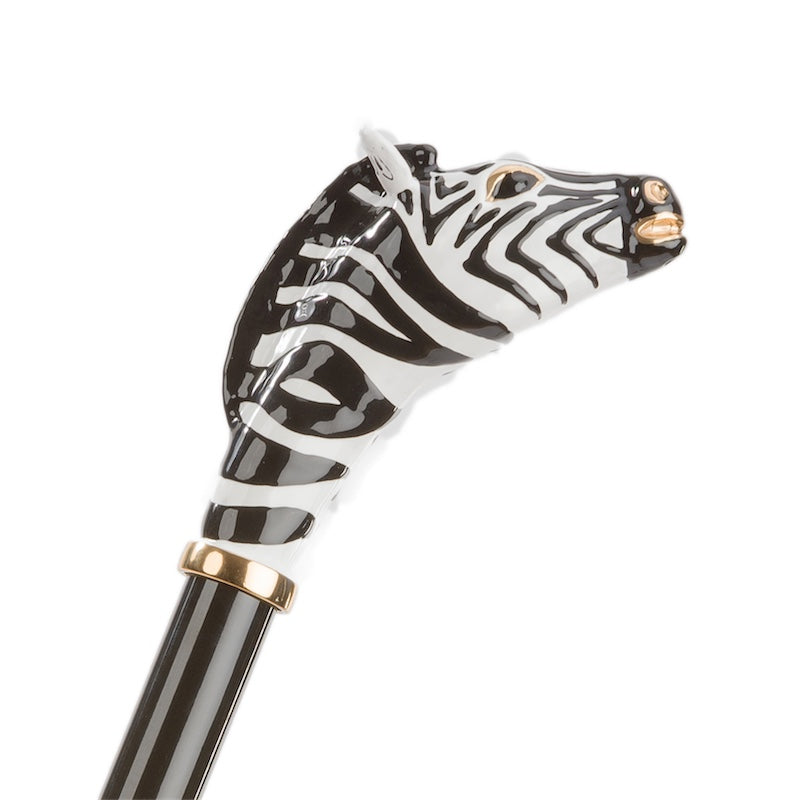 Black and white enameled zebra head on a gold-tone collar above the black shaft