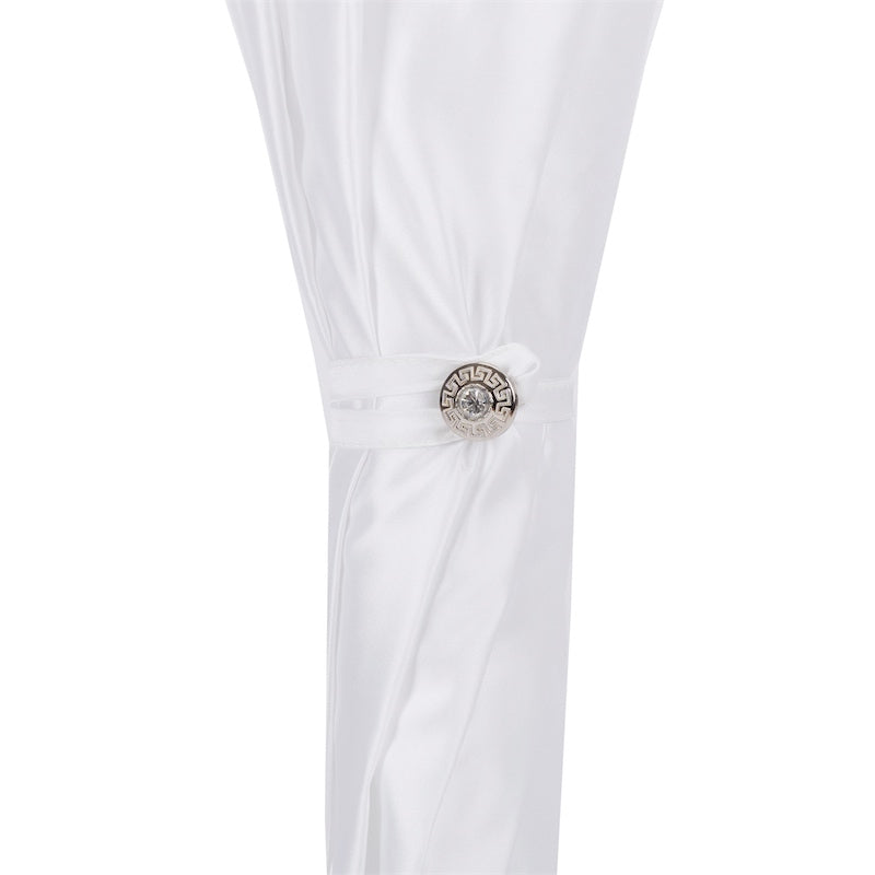 White curtain with a decorative tieback featuring a circular design on a white background