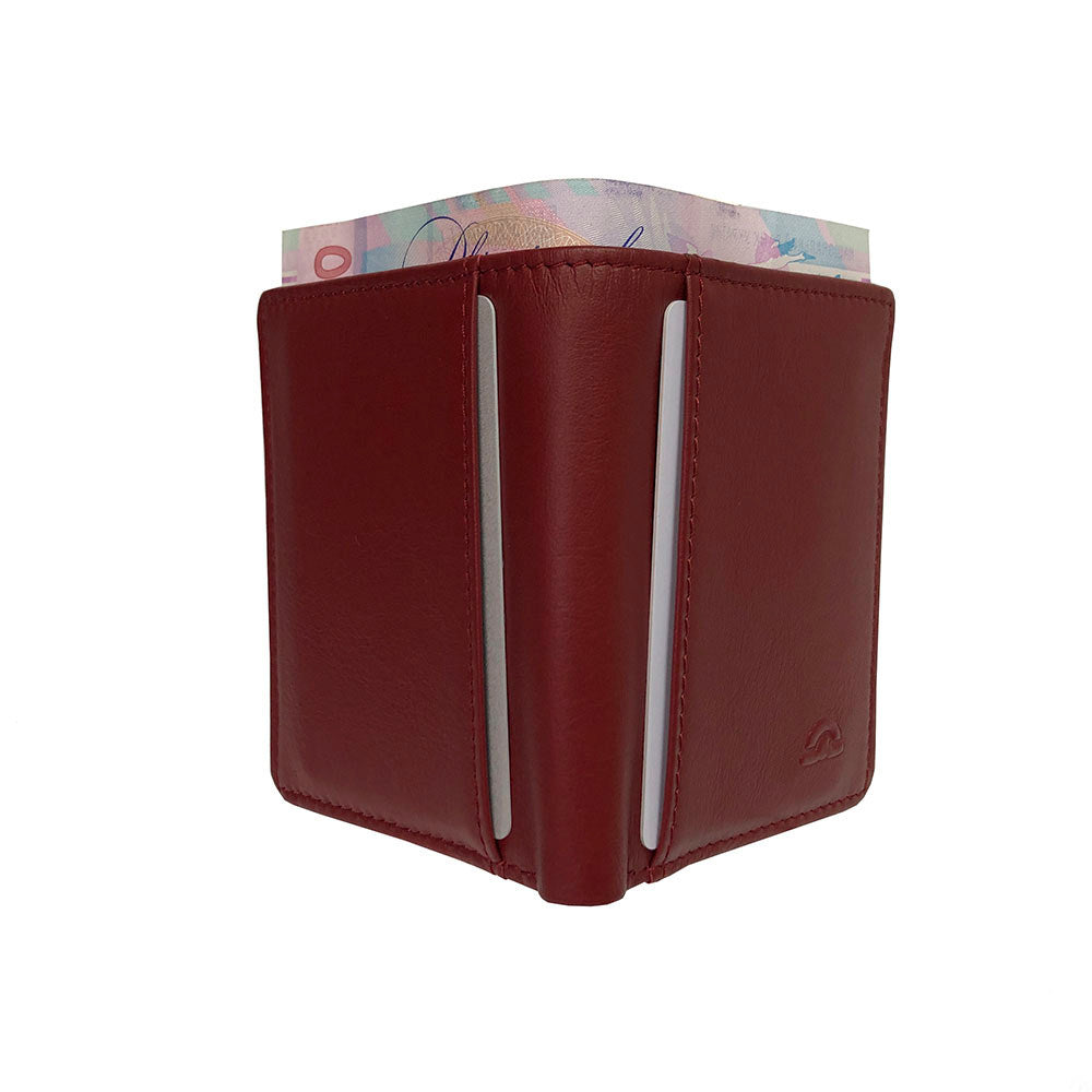 Tony Perotti New Rainbow 1034 rosso — standing closed with a banknote showing above the top edge