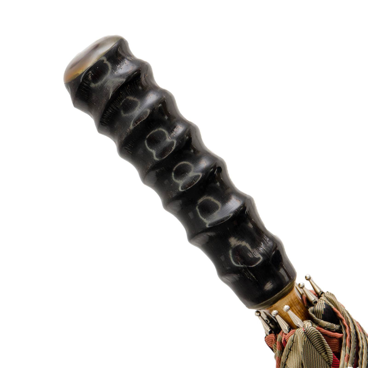 Oryx horn handle with natural raised rings above the furled tartan canopy