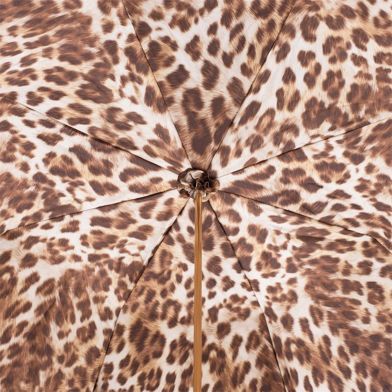 Inside of the canopy: leopard print in brown on a cream ground