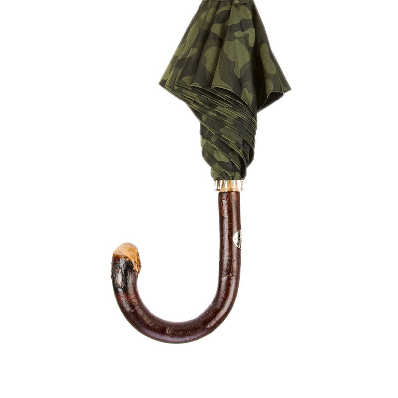Reddish-brown chestnut crook below the furled camouflage canopy