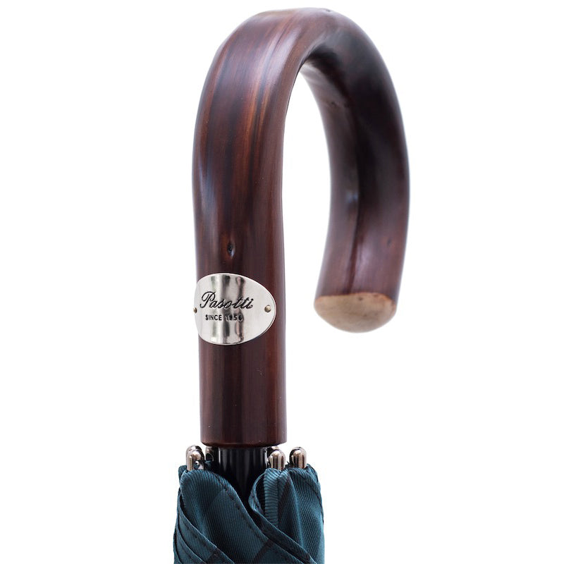 Dark chestnut crook handle with oval silver-tone Pasotti plaque, close-up, handcrafted in Italy