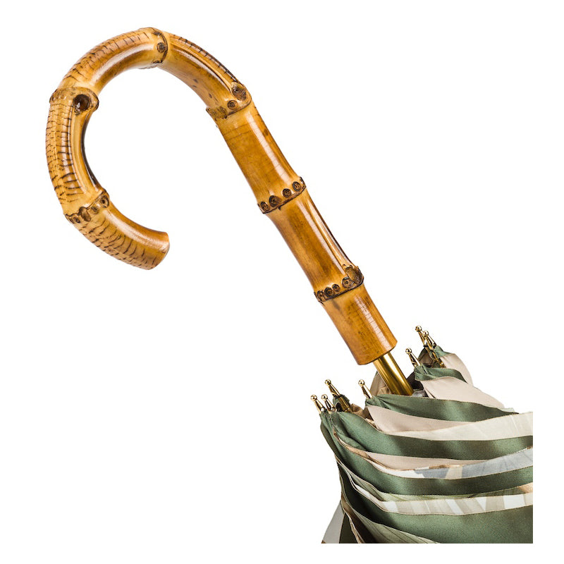 Bamboo crook handle above the furled double canopy with gold-tone rib tips