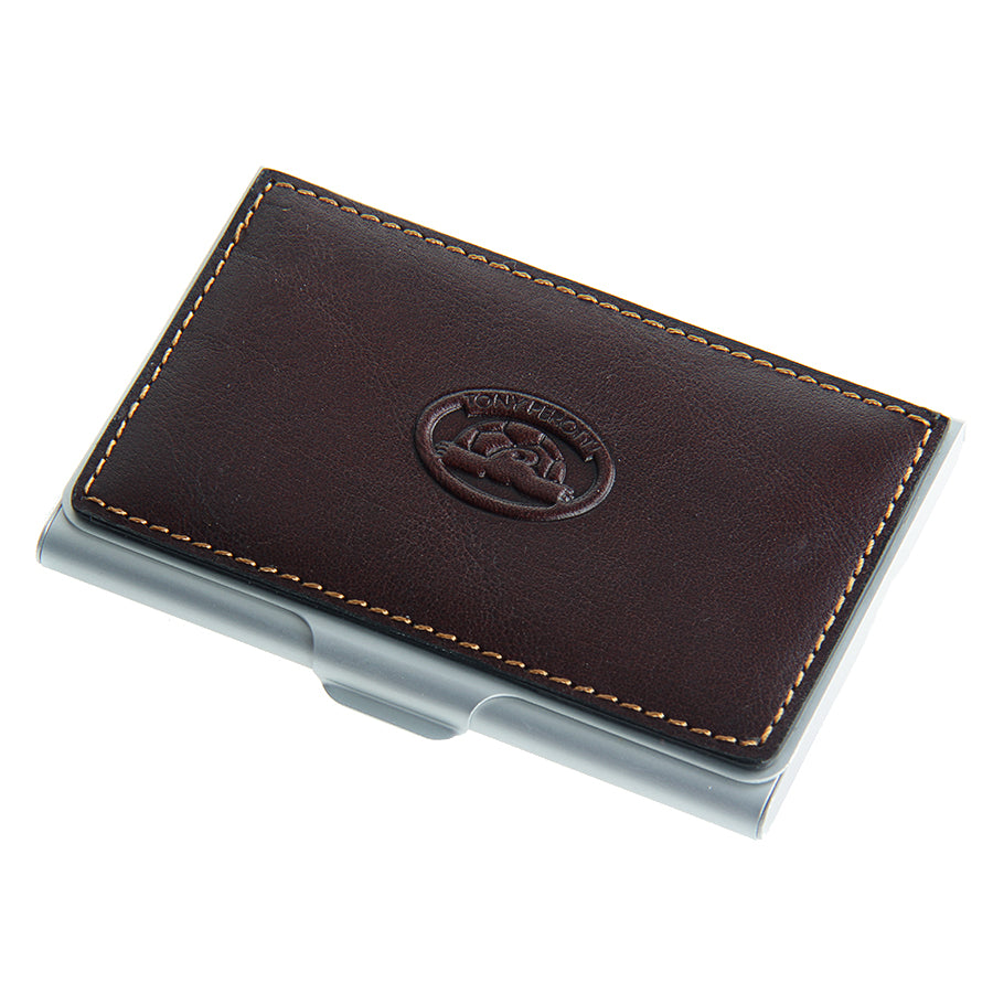 Tony Perotti Italico 2204 moro — three-quarter view showing the metal shell and the tan stitching on the leather lid