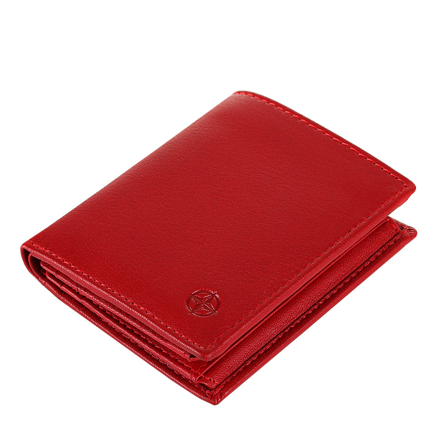 Red Tony Perotti Cortina 5088 rosso card wallet lying tilted — the closed fold and the embossed compass rose