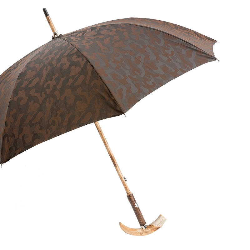 Open brown camouflage umbrella from the side with knotted wooden shaft and tusk handle