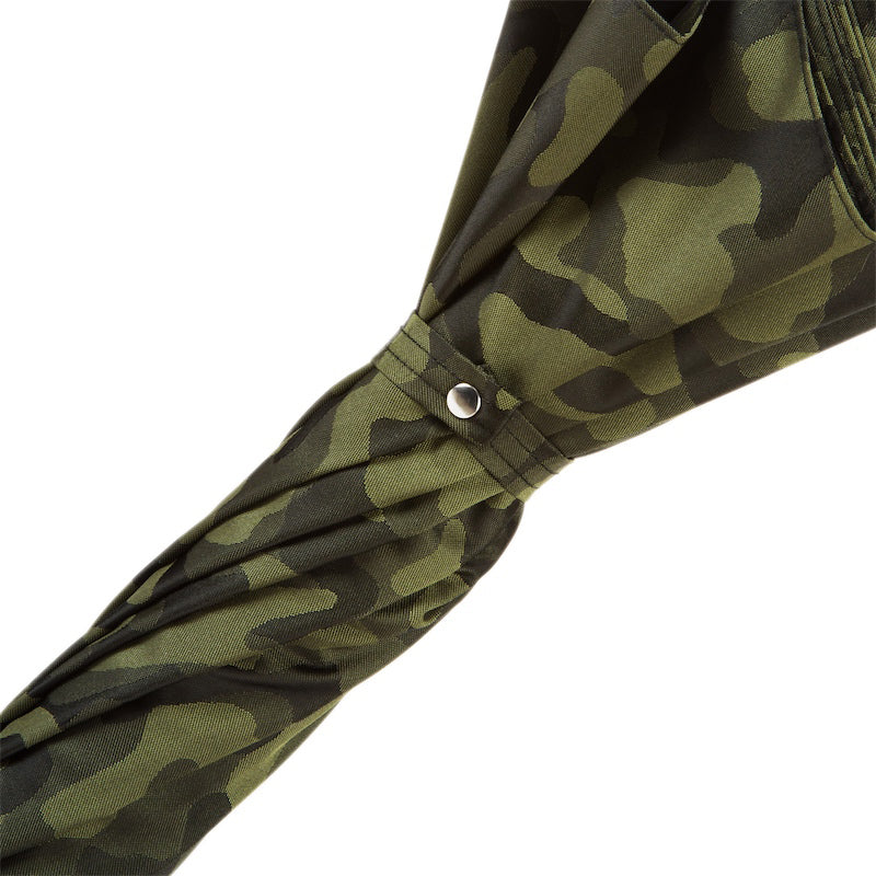 Fabric strap with silver-tone snap button on the furled camouflage canopy