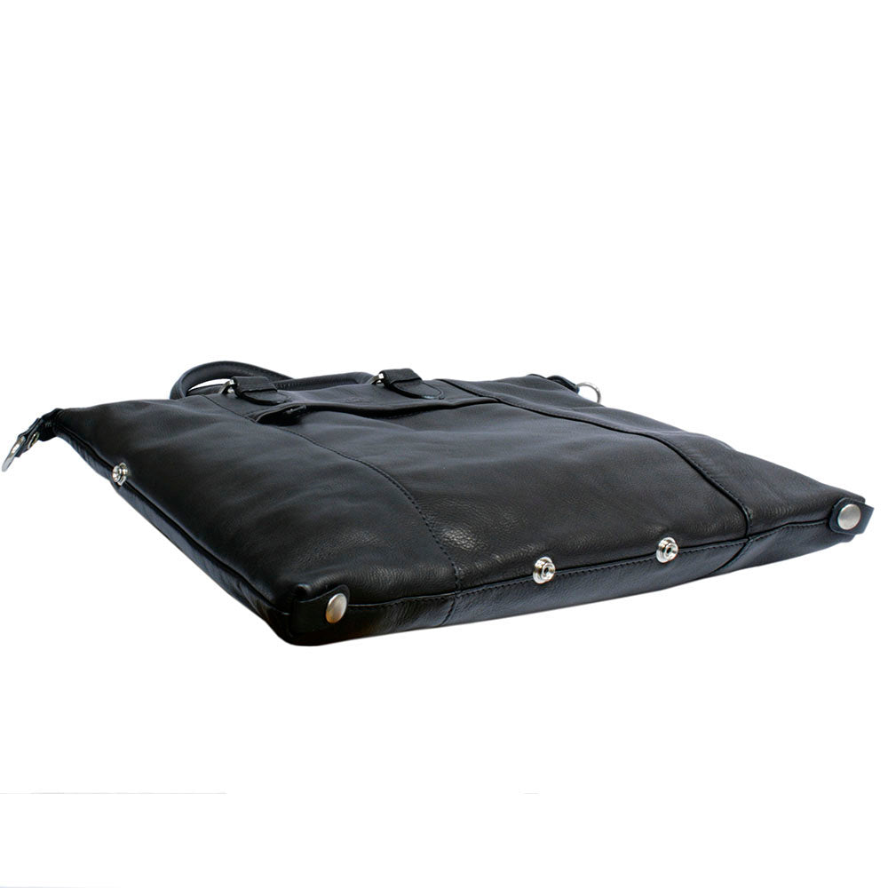 Base of the Tony Perotti Contatto 9217-31 nero handbag laid flat — the row of dark silver snap studs that set the shape