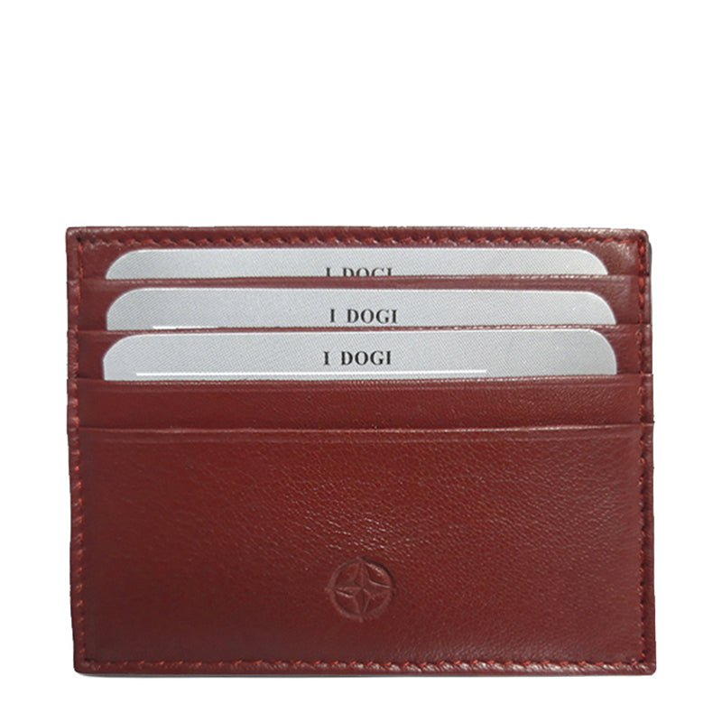 Tony Perotti Cortina 5043 rosso — front face of the red leather card holder with cards in the three slots and the embossed compass rose