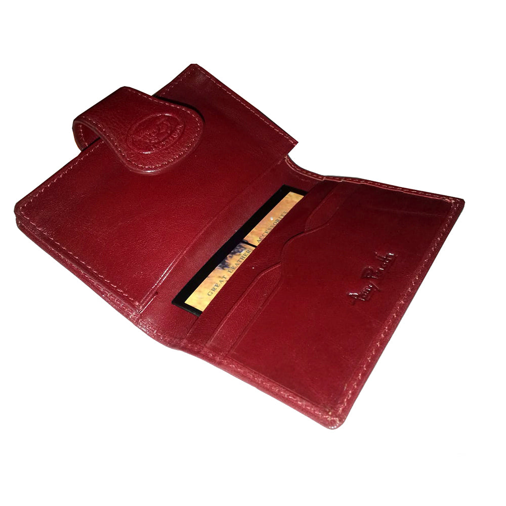 Open red Accademia 1440 business card holder — card slots and the embossed Tony Perotti signature on the red leather interior