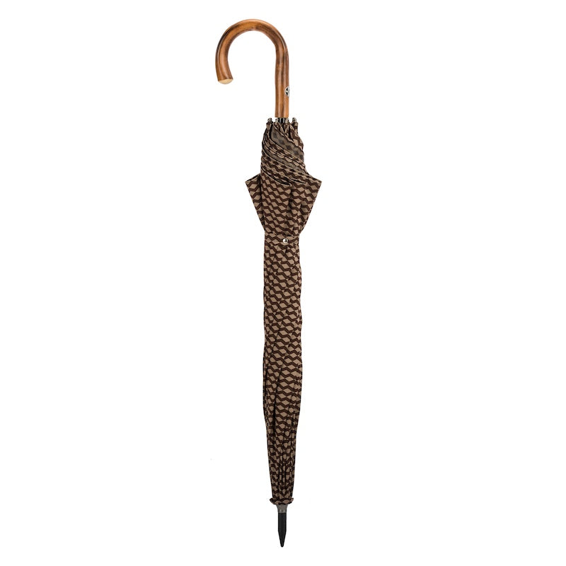 Closed brown and beige umbrella standing upright with the chestnut crook handle