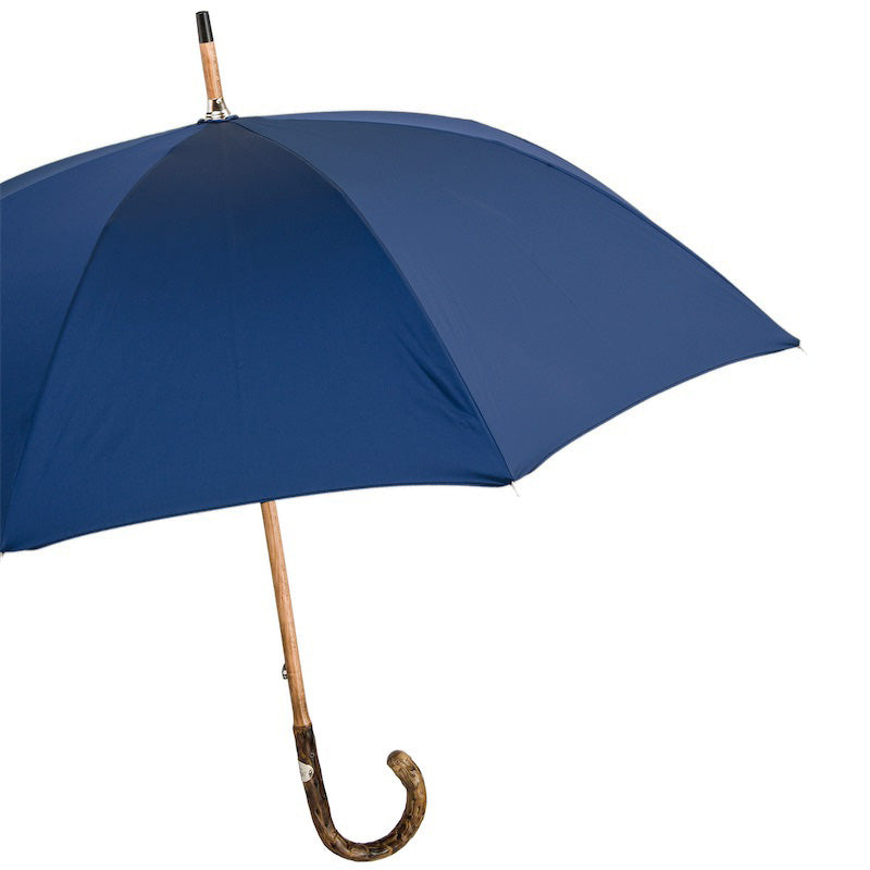 Open navy umbrella from the side with natural wood shaft and crook handle
