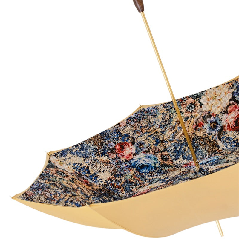 Underside of the open canopy with the floral print and gold-tone shaft
