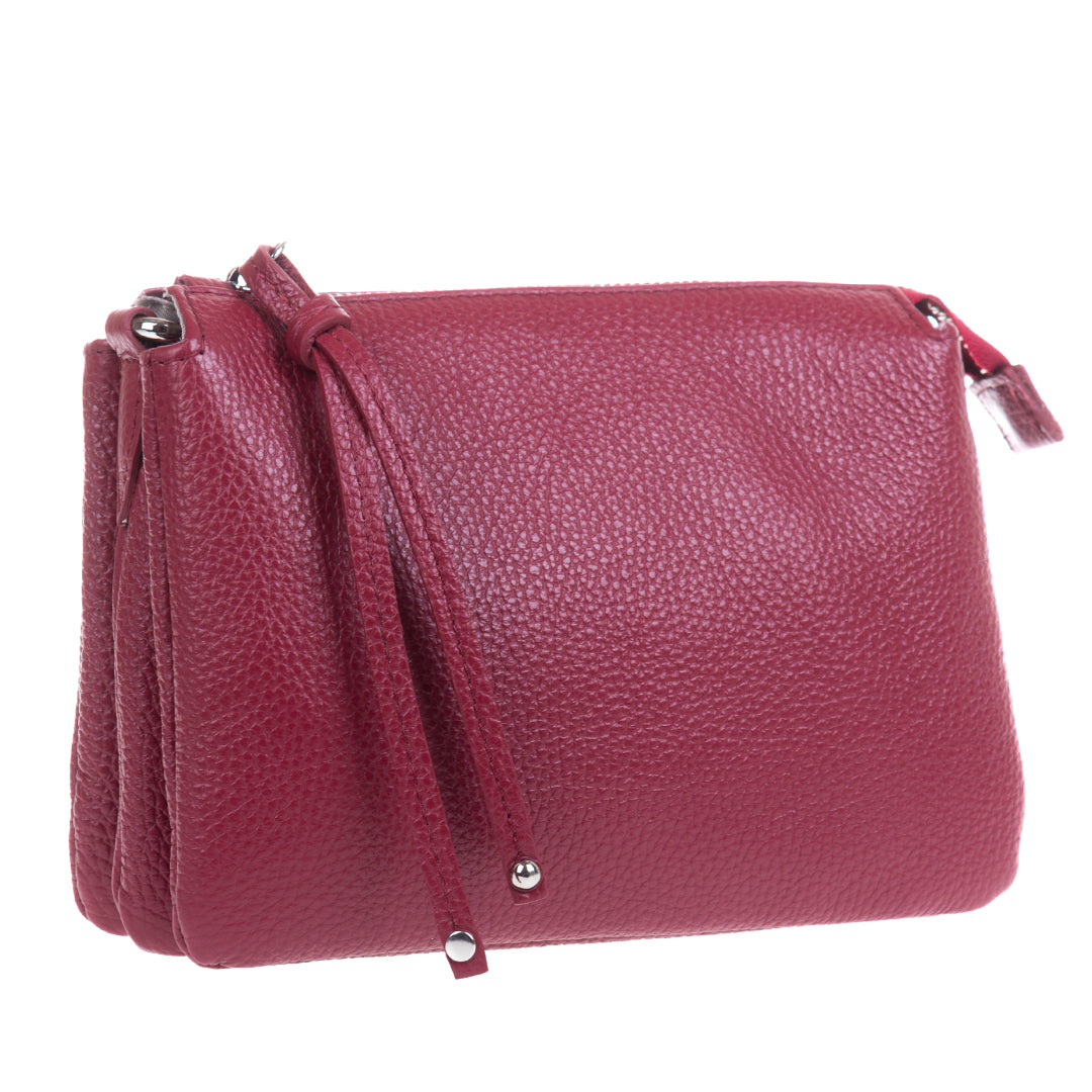 Tony Perotti Borsa CA04B-30DR women's red leather crossbody bag at an angle — pebbled leather, with the three inner compartments showing along the side