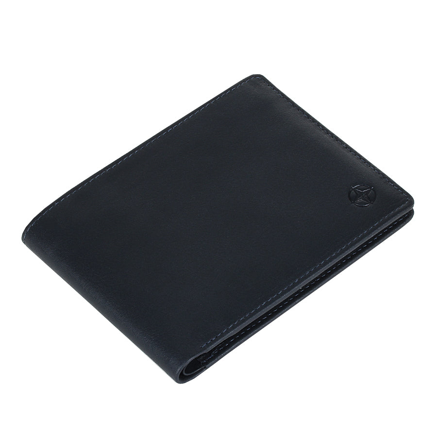 Navy Tony Perotti Cortina 5014 wallet lying closed, seen from above — the fold and the slim profile