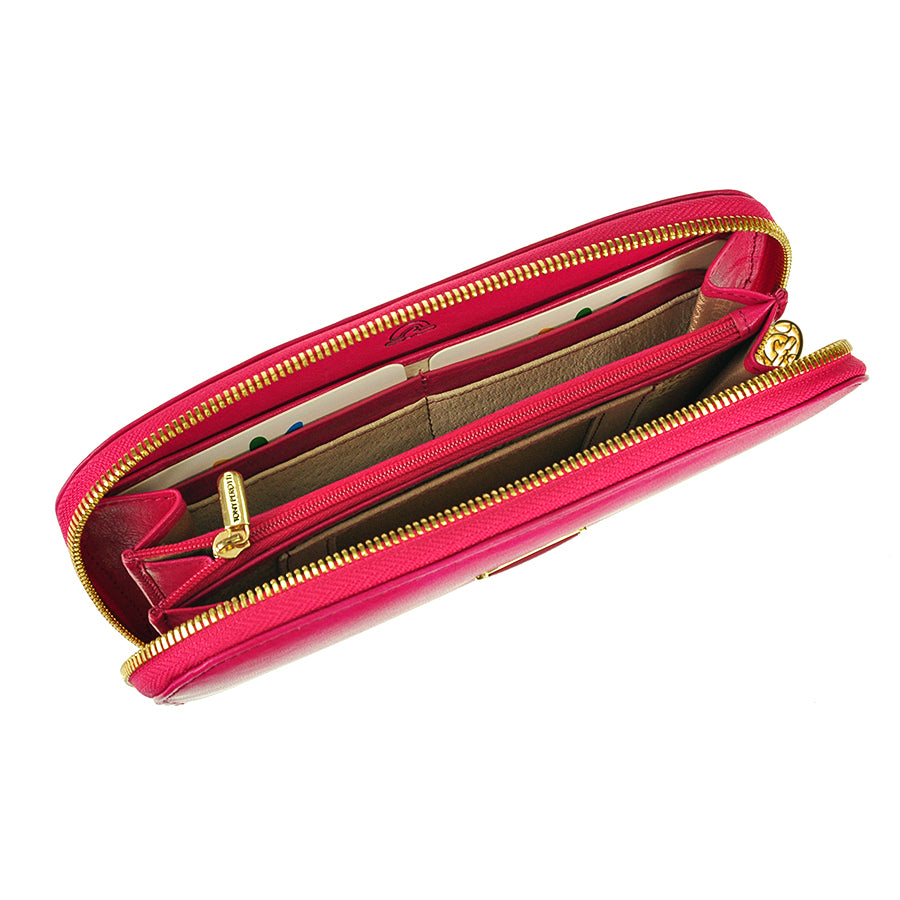 Raspberry pink Topkapi zip-around wallet open showing card slots and central zip coin pocket