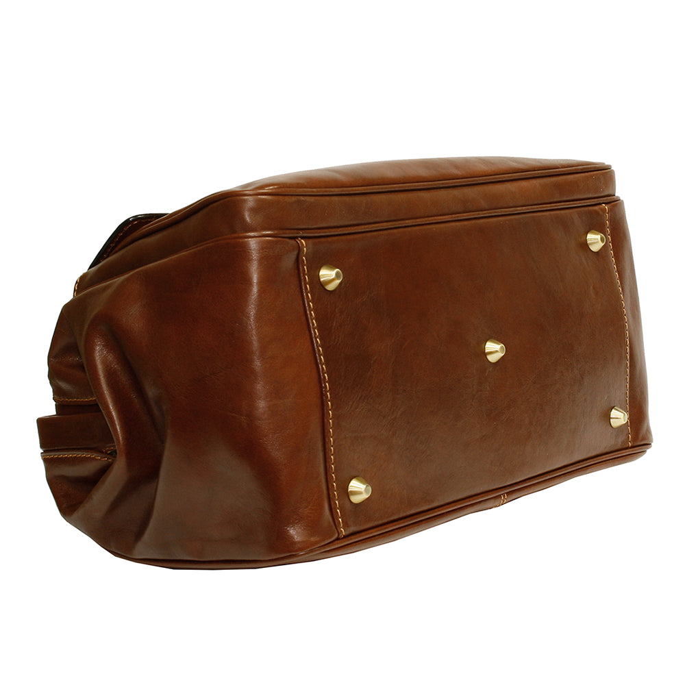Bottom of the cognac Italico 8051 doctor bag — five protective brass feet
