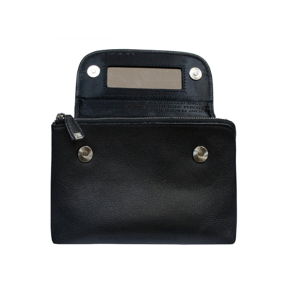 Open Tony Perotti black leather cosmetic bag showing built-in mirror and magnetic snap closure