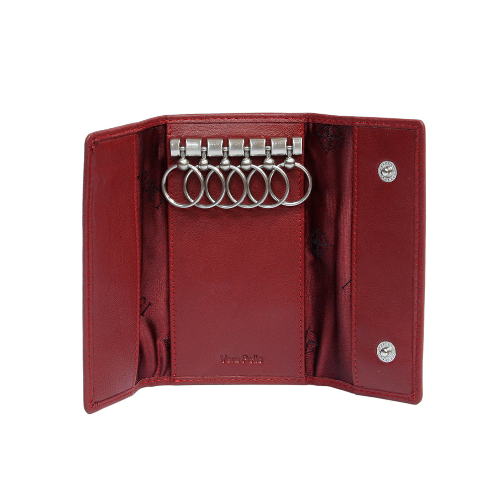 Tony Perotti Cortina 5041 rosso — opened flat: six key rings on the metal bar, red «I DOGI» motif lining and two press studs