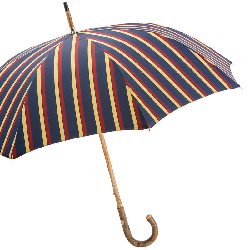 Open regimental-stripe umbrella from the side with ash shaft and crook handle