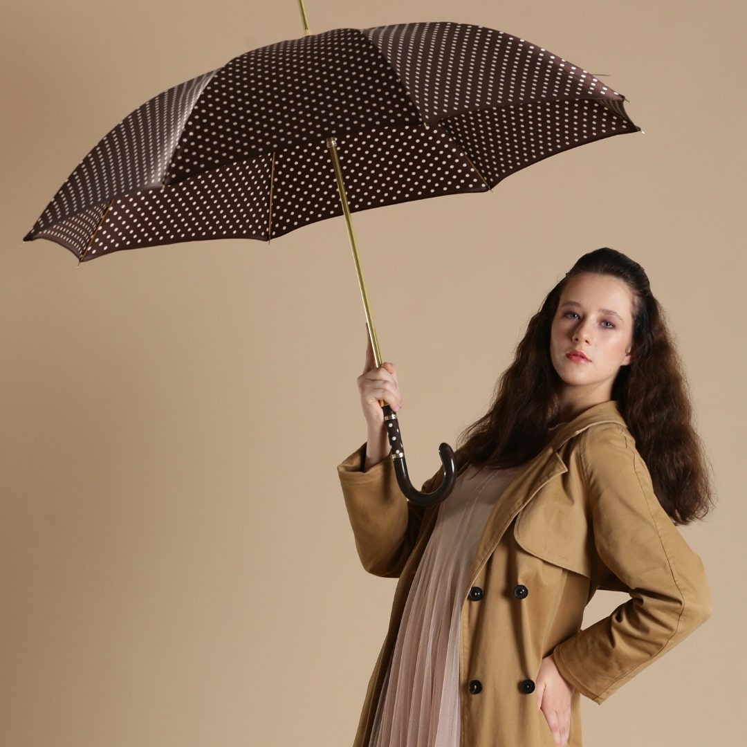 Girl with Pasotti brown polka dot umbrella - img 1