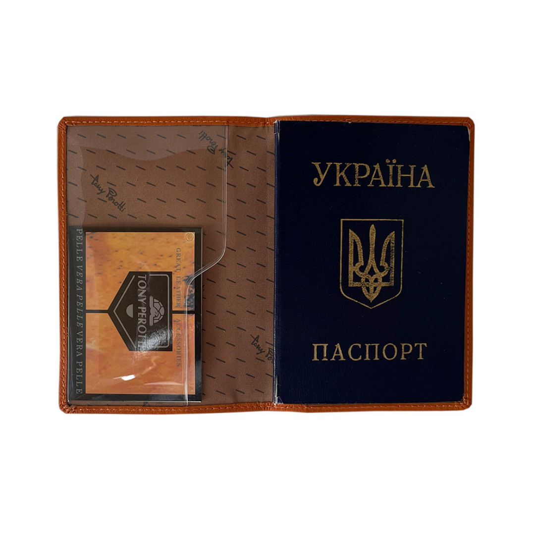 Tony Perotti Contatto 2241 arancio passport cover opened, with a passport slid into the right-hand transparent pocket