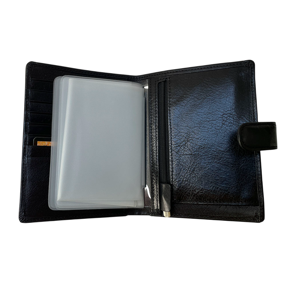 Tony Perotti Italico 3274A nero passport wallet opened with the insert booklet turned over, showing the vertical zip pocket along the spine