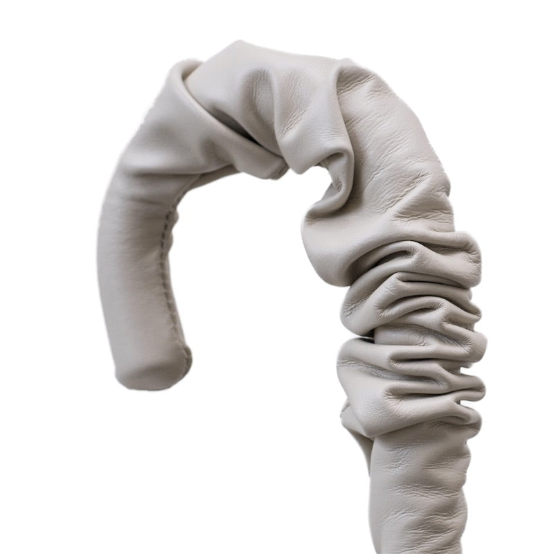 Ruched light grey-beige leather crook handle, close-up, handcrafted in Italy