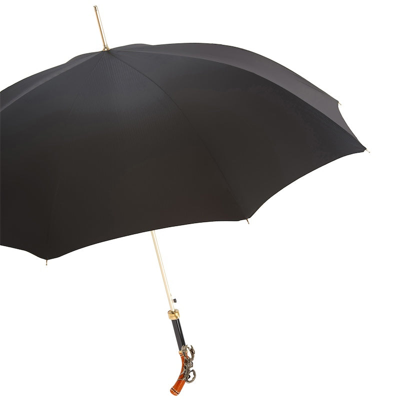 Open black umbrella from the side with gold-tone shaft and scorpion handle
