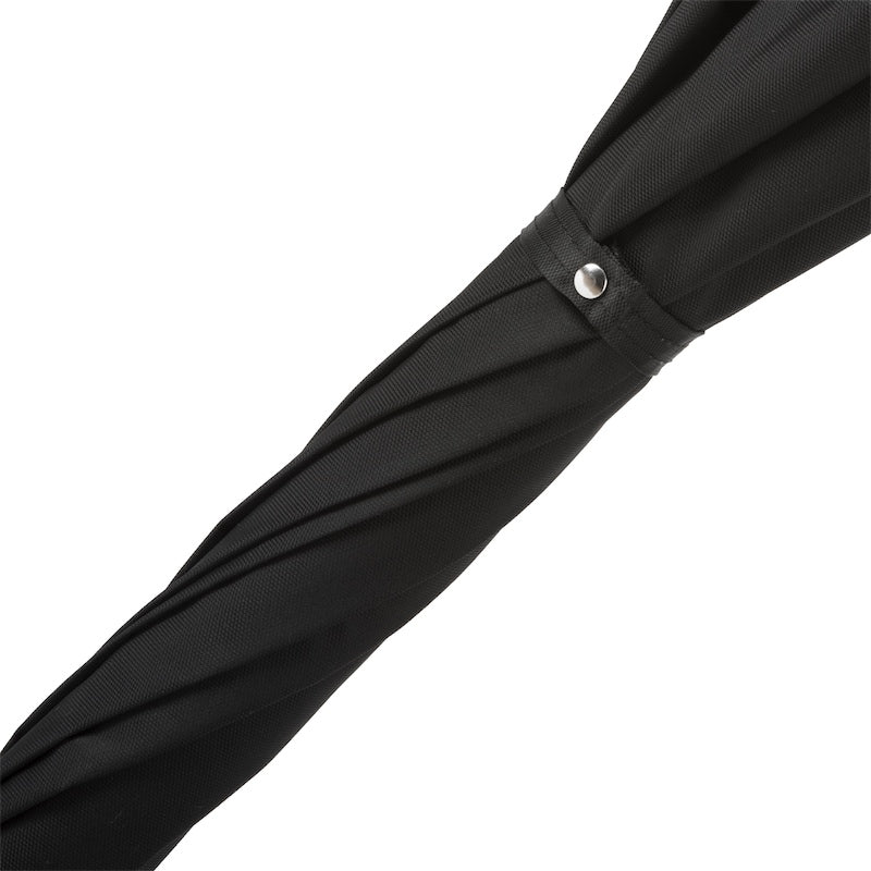 Fabric strap with silver-tone snap button on the furled black canopy