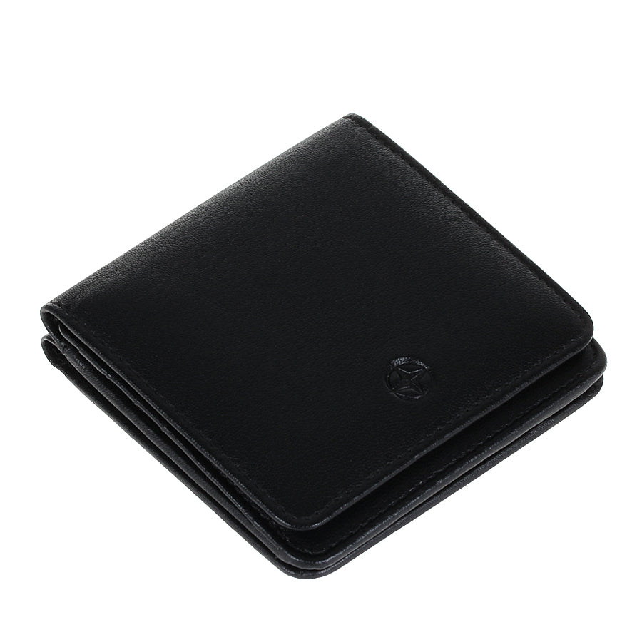 Black Tony Perotti Cortina 5064 wallet lying closed, seen from above — the flap and the layered folds