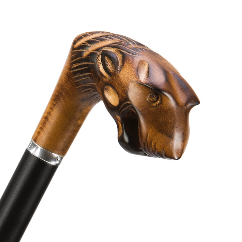 Hand-carved wooden tiger head handle with open mouth and silver-tone ring, close-up, handcrafted in Italy