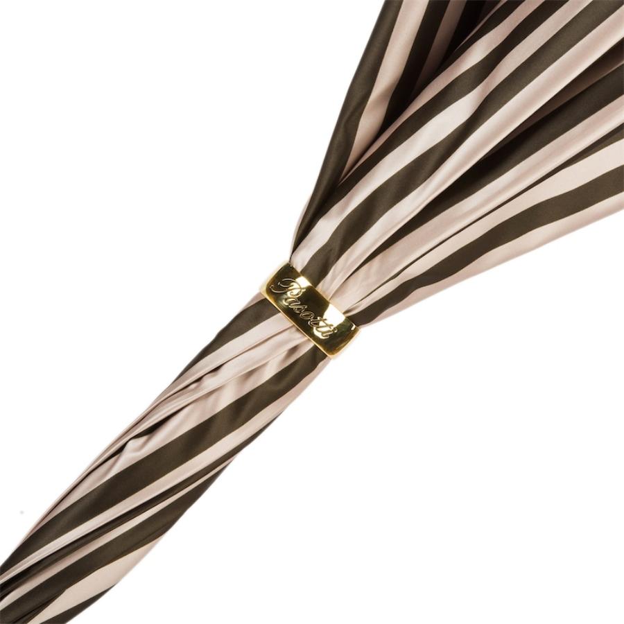 Gold-tone ring engraved Pasotti on the furled brown and beige striped canopy