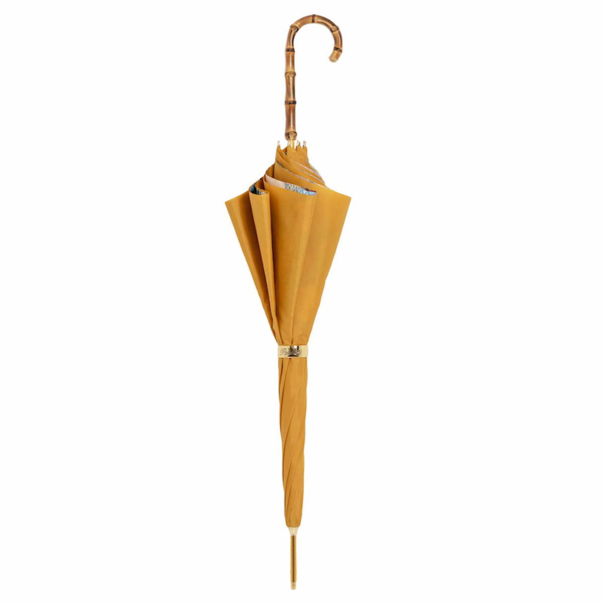 Closed mustard yellow umbrella standing upright with the bamboo crook handle and gold-tone ring