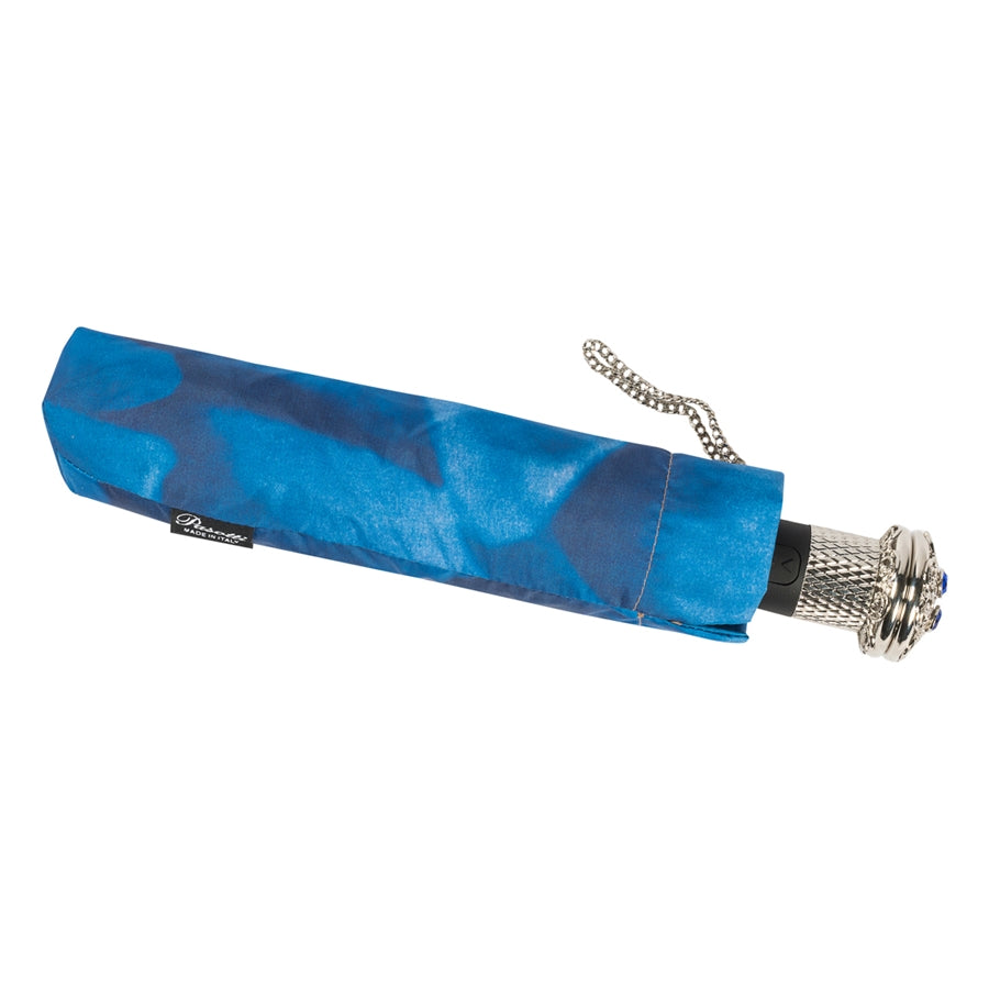 Closed Pasotti blue dahlia folding umbrella with chain handle detail