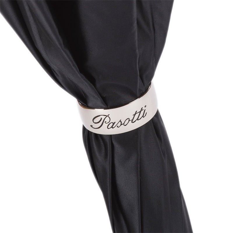 The black Pasotti women's umbrella with skull is held closed with a branded ring