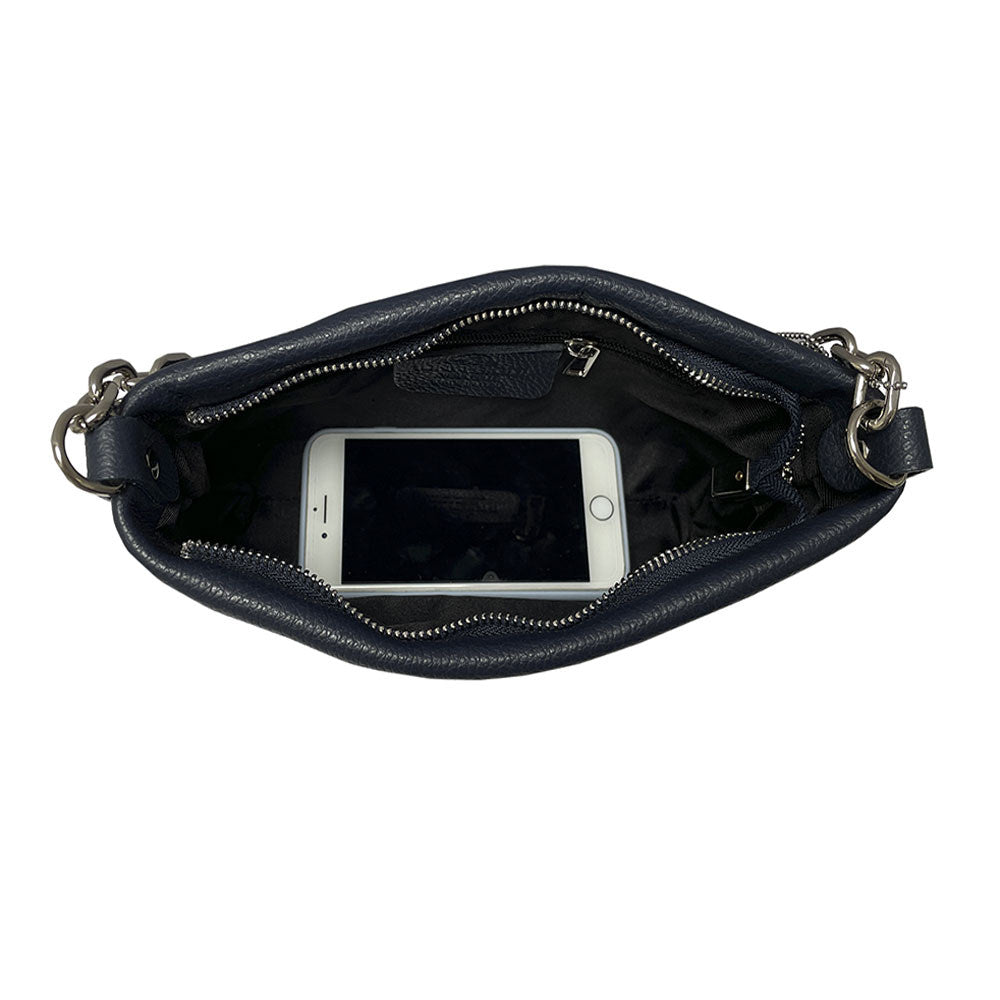 Inside the Tony Perotti Borsa CA045-01BL navy leather bag with a phone laid in it to show the capacity