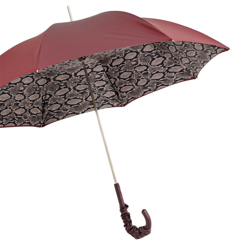 Side view of the Pasotti burgundy umbrella with python-print interior