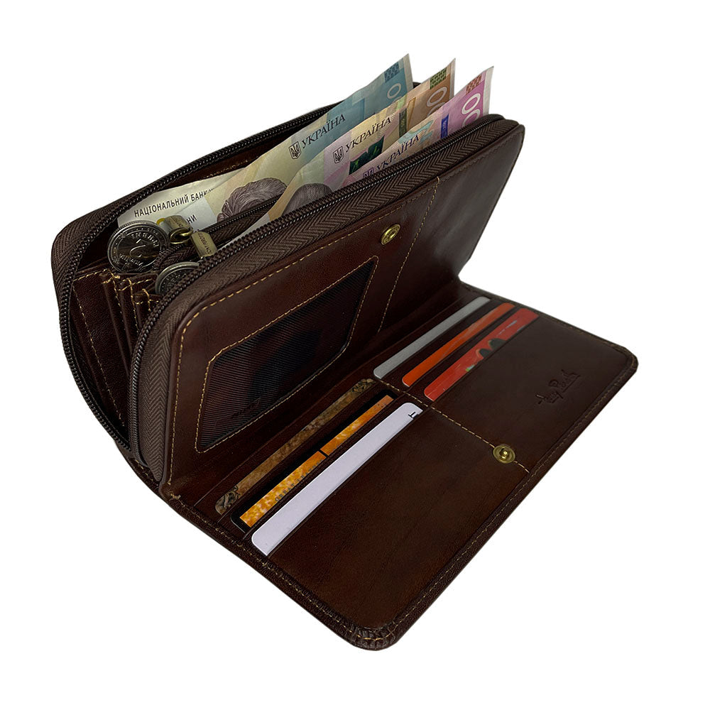 Tony Perotti dark brown leather zip-around wallet with money and cards on a white background