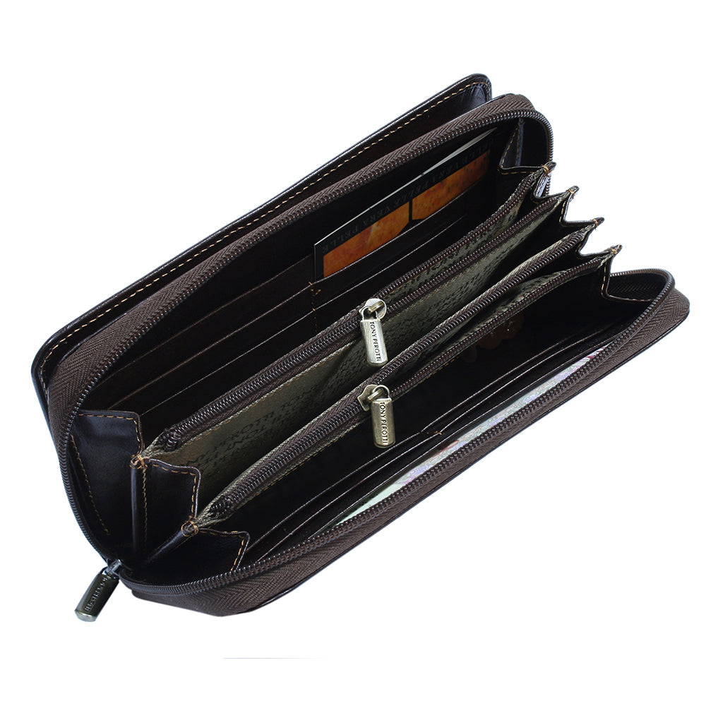 Open Tony Perotti dark brown leather wallet with multiple card slots on a white background
