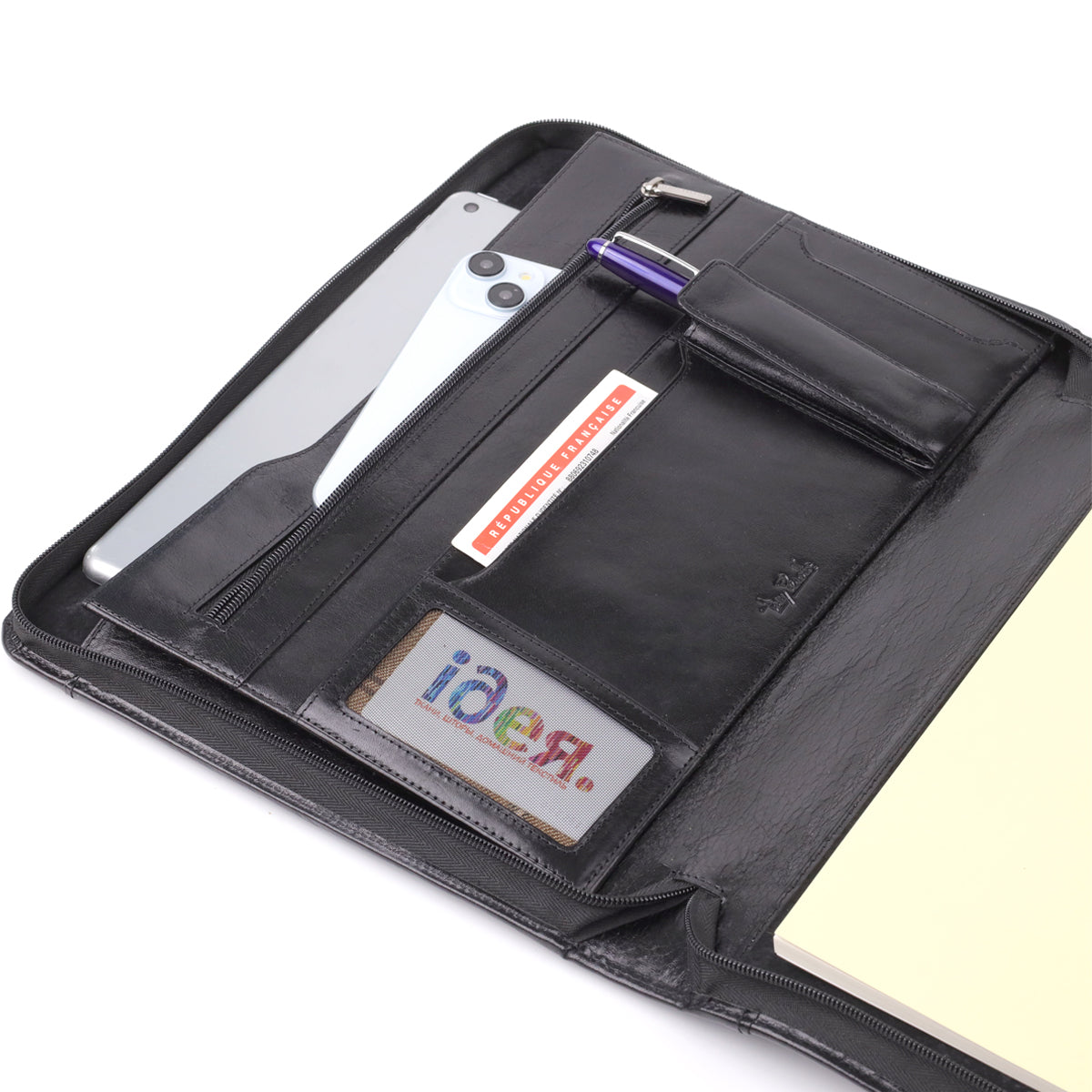 Organiser panel of the black Italico 1278L padfolio in use — tablet and phone in the slip pocket a pen in the holder a business card in a slot and a card in the clear window