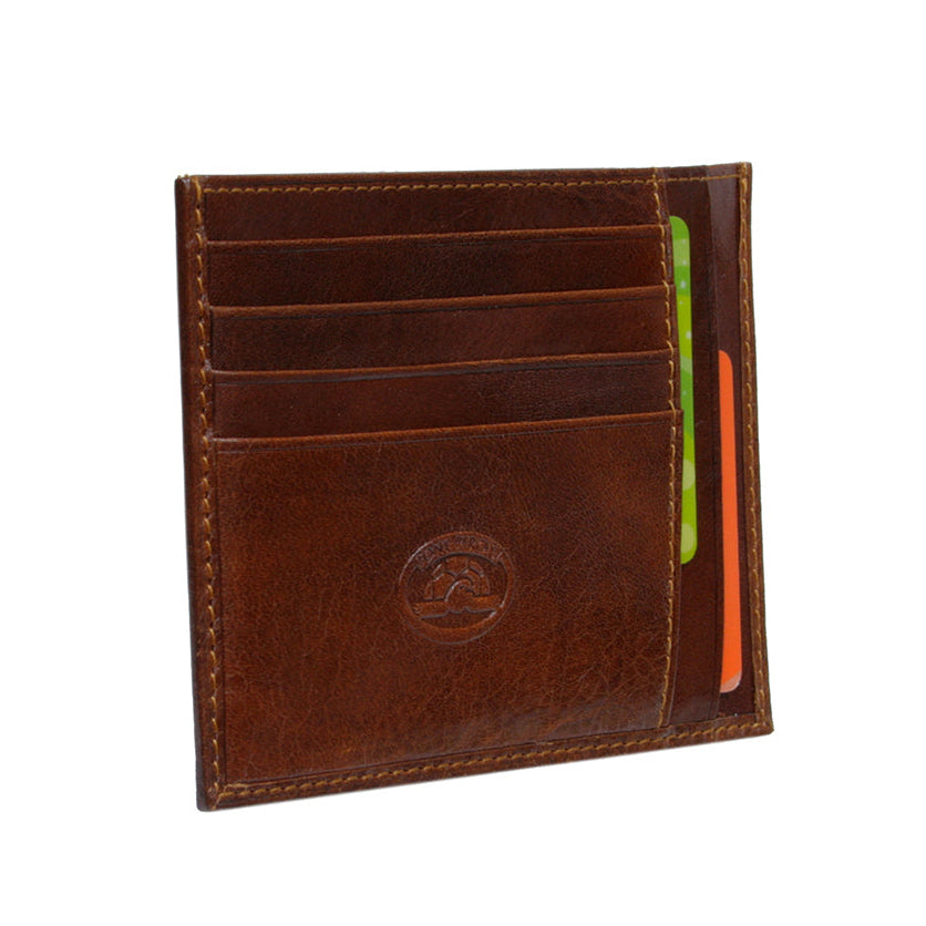 Tony Perotti Italico 2171 cognac leather card holder — angled view with four card slots, embossed turtle emblem and cards inside